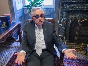 Senate Minority Leader Harry Reid of Nev. talks about the compromise process of working on the $1.1 trillion omnibus spending bill with the Republicans holding the majority in Congress, Thursday, Dec. 17, 2015, during an interview with The Associated Press in his leadership office on Capitol Hill in Washington. Reid is backing the measure and the White House says President Barack Obama would sign the 2,200 page tax and spending bills. Now 76 years old and a senator since 1987, the top Democrat in the Senate has said he will retire at the end of the 114th Congress in 2016.  (AP Photo/J. Scott Applewhite)