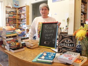 Elaine Allen, of Anne's Book Place, still touts paper-and-ink books at her Russell Street South shop on Wednesday December 2, 2015 in Sarnia, Ont. About 40,000 books line the store's shelves, ranging from classic literature to mysteries and thrillers. In May, Allen welcomed The Eclectic Market -- a shop featuring handmade clothing, scarves, cards and other wares -- into a portion of her store. Barbara Simpson/Sarnia Observer/Postmedia Network