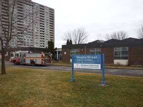 Ottawa fire fighters battled a small fire at Regina St. Public School on Friday morning, Dec. 18, 2015. There were no injuries, and the flames were quickly contained. (JULIENNE BAY Ottawa Sun / Postmedia Network)