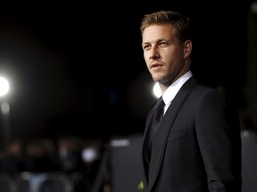 Luke Bracey poses at the premiere of "Point Break" in Hollywood, California December 15, 2015. The movie opens on December 25.  (REUTERS/Mario Anzuoni)