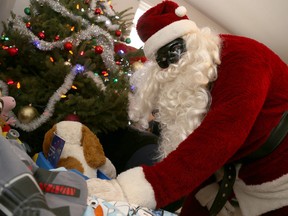 Emily Mountney-Lessard/The Intelligencer
Santa helps with an extra-special Christmas delivery in Tweed, on Friday.