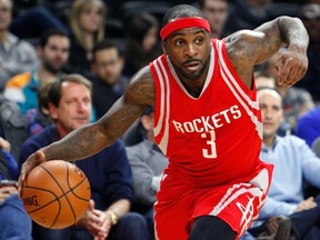 Houston Rockets guard Ty Lawson dribbles the ball during the fourth quarter against the Detroit Pistons at The Palace of Auburn Hills on Nov. 30, 2015. (Raj Mehta/USA TODAY Sports)