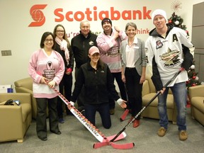 ERNST KUGLIN/THE INTELLIGENCER
The third annual Pink in the Rink hockey game and Canadian Cancer Society fund raiser will be held at the Duncan MacDonald Community Gardens in Trenton on Jan. 6, 2016. Left to right are Michelle MacKay, of Scotiabank, Sarah Ditmars, Trenton Golden Hawks head therapist, Golden Hawks operations manager John McDonald, Brad Warner of the Canadian Cancer Society, Lucie Renaud, of Scotiabank, and Golden Hawks left winger Hunter Fargey. In the centre is Pink in the Rink special guest, goalie Kira Hurley.