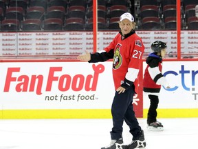 OTTAWA - Dec 18, 2015 - Senators owner Eugene Melnyk takes a twirl on the ice at Canadian Tire Centre in Kanata (Ottawa), Friday, December 18, 2015. The Eugene Melnyk Skate for Kids attracted attracted about 100 school-aged children who all received skates, helmets and jerseys. MIKE CARROCCETTO / OTTAWA SUN / POSTMEDIA NETWORK