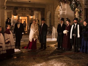 Helene Joy and Yannick Bisson, centre, star in Murdoch Mysteries' the two-hour holiday special A Merry Murdoch Christmas. (Handout)