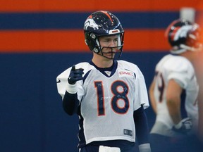Broncos quarterback Peyton Manning warms up during a practice at the team's headquarters in Englewood, Colo., on Wednesday, Dec. 16, 2015. (David Zalubowski/AP Photo)