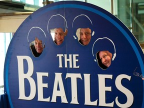 Tourists poses as Beatles in a themed coffee shop in Liverpool northern England, Britain, March 2, 2015. (REUTERS/Phil Noble)
