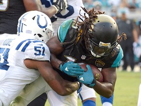 Denard Robinson (right) should carry the load at running back for the Jaguars this weekend. (Phelan M. Ebenhack/AP Photo)