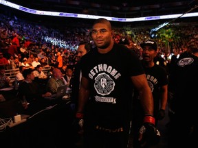 Alistair Overeem walks from the octagon after his KO victory over Stefan Struve in their heavyweight bout during the UFC Fight Night event at U.S. Airways Center in Phoenix on Dec. 13, 2014. (Christian Petersen/Getty Images/AFP)