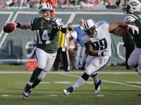 In this Sunday, Dec. 13, 2015 file photo, New York Jets quarterback Ryan Fitzpatrick throws a pass away from Tennessee Titans' Jurrell Casey during a game in East Rutherford. (AP Photo/Julie Jacobson, File)
