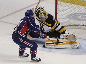 Hamilton Bulldogs Niki Petti scores on a short-handed breakaway on Kingston Frontenacs goalie Jeremy Helvig during Ontario Hockey League action at the Rogers K-Rock Centre in Kingston on Friday night. (Ian MacAlpine/The Whig-Standard)