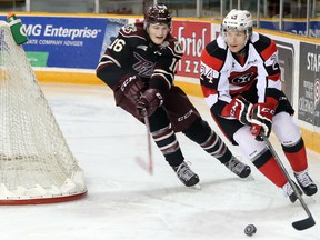 Ottawa 67’s defenceman Nevin Guy is chased behind his net by Steven Lorentz of the Peterborough Petes as the teams met at TD Place on Friday, Dec. 18, 2015.
(Chris Hofley/Ottawa Sun)