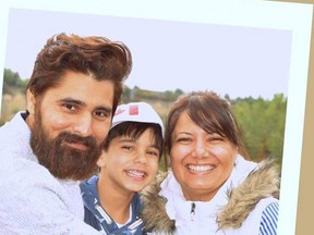 Karanpal Singh Bhangu, 35, is seen with his son Royce, and his wife Kiran in this family photo posted on a GoFundMe page created to raise funds for the family after Bhangu and 41-year-old Ricky Massin Cenabre were shot and killed during separate robberies at two Mac’s convenience stores in south Edmonton on Friday. PHOTO SUPPLIED