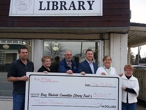 Southwold Mayor Grant Jones, left, treasurer Kim Grogan and Rosy Rhubarb Library Committee member Keith Orchard accept a $3,000 donation from the Elgin St. Thomas Community Foundation for the Shedden Library relocation project. Organizers are hoping to break ground on the $570,000 addition to the Keystone Complex in 2016.