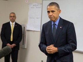 President Barack Obama delivers a statement at Indian Springs High School after meeting with families affected by the shootings in San Bernardino, Calif., on Friday, Dec. 18, 2015, in San Bernardino. (AP Photo/Evan Vucci)