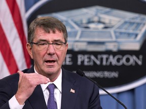 FILE - In this Dec. 11, 2015 file photo, Defense Secretary Ash Carter speaks to reporters at the Pentagon.  Ash Carter told his Afghan counterpart Friday in Jalalabad that the United States is “with you,” committed to supporting Afghan security forces and building their capabilities for years to come. Carter made a one-day visit to Afghanistan to assess the fragile security situation, amid reports of increased violence and a growing campaign by Islamic State loyalists to gain a foothold in the eastern part of the country.  (AP Photo/Manuel Balce Ceneta)