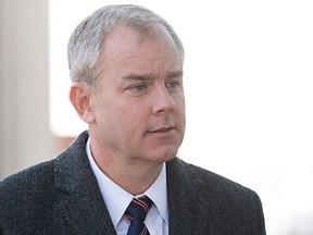 Dennis Oland arrives at the Law Courts as his murder trial continues in Saint John on Wednesday, October 21, 2015. Oland is found guilty of second degree murder in the death of his father, Richard Oland. (The Canadian Press/Andrew Vaughan)