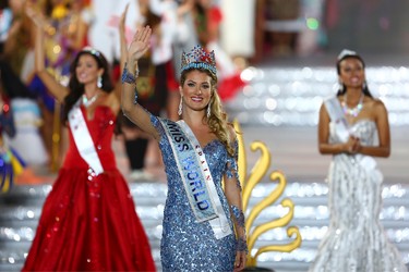 Newly crowned Miss World Mireia Lalaguna Royo from Spain celebrates after at the end of the 2015 Miss World Grand Final in Sanya in south China's Hainan province Saturday Dec. 19, 2015. Spain's Mireia Lalaguna Royo was named the winner of the Miss World 2015 competition Saturday night in the southern Chinese island resort of Sanya, an event dogged by controversy over China's refusal to allow Canada's entrant to attend. (Chinatopix Via AP)