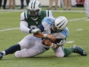 New York Jets defensive end Muhammad Wilkerson sacks Tennessee Titans quarterback Marcus Mariota (8) Sunday, Dec. 13, 2015, in East Rutherford, N.J. (AP Photo/Peter Morgan)