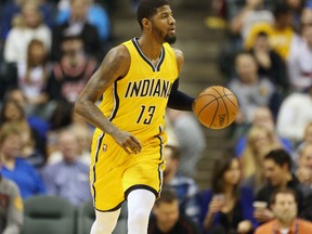 Indiana Pacers forward Paul George brings the ball up court against the Miami Heat at Bankers Life Fieldhouse. (Brian Spurlock/USA TODAY Sports)