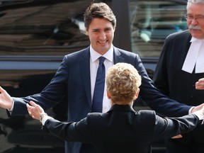 Then-prime minister-designate Justin Trudeau arrived at Queen's Park on Oct. 27, 2015 to be greeted by Ontario Premier Kathleen Wynne. (Michael Peake/Toronto Sun files)
