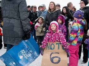 Mikaela Wilson, 4, waits in front as her mother rallies the protestors to arrange a convoy of tractors and trucks to travel through town in Stony Plain on Friday, Dec. 11. The convoy proceeded through Stony Plain and Spruce Grove, and ended in St. Albert in front of MLA Trevor Horne’s office. Bill 6: Enhanced Protection for Farm and Ranch Workers Act, passed third reading at the Alberta legislature on Dec. 10 and farmers are now hoping to petition the government to stop the bill. - Yasmin Mayne, Reporter/Examiner