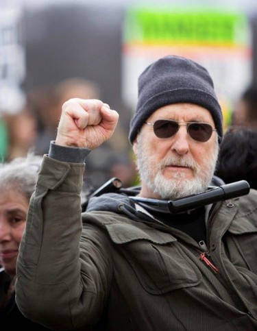 Actor James Cromwell protests at a power plant that is under construction in Wawayanda, N.Y., Friday, Dec. 18, 2015. New York state police say the several protesters who were arrested blocked an entrance to the construction site at the Competitive Power Ventures power plant. (Erik Gliedman/Times Herald-Record via AP)
