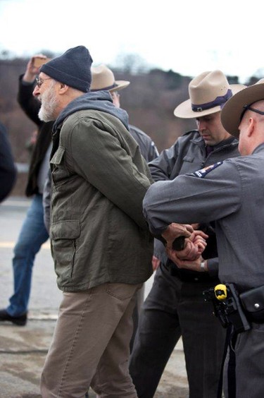 Actor James Cromwell is arrested at a power plant that is under construction in Wawayanda, N.Y., Friday, Dec. 18, 2015. New York state police say several protesters who were arrested blocked an entrance to the construction site at the Competitive Power Ventures power plant. (Erik Gliedman/Times Herald-Record via AP)
