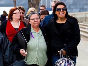 Peacha Atkinson, centre, mother of Nina Courtepatte, leaves the court house in Edmonton on Wednesday, April 11, 2012. Michael Briscoe has been found guilty of first degree murder in the 2005 slaying of Courtepatte. CODIE MCLACHLAN/EDMONTON SUN