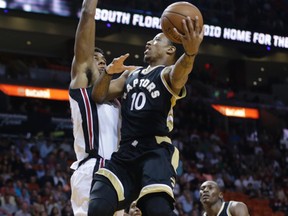 Toronto Raptors' DeMar DeRozan goes to the basket as Miami Heat's Hassan Whiteside, left, defends during the first half of an NBA basketball game, Friday, Dec. 18, 2015, in Miami. (AP Photo/Lynne Sladky)