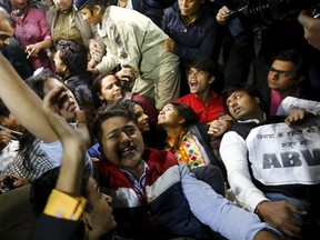 Demonstrators shout slogans as police detain others during a protest against the release of a juvenile rape convict, in New Delhi, India, December 20, 2015. The youngest of six people convicted of the 2012 gang rape of a woman, in a case that shocked India, was freed on Sunday, a lawyer said, after a court refused to extend his three-year sentence. The case turned a global spotlight on the treatment of women in India, where police say a rape is reported every 20 minutes, and the sentence sparked debate over whether the country is too soft on young offenders. (REUTERS/Adnan Abidi)