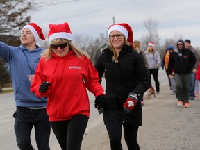 Runners donned Santa hats to take part in the fifth annual Santa Run at The Right Fit, on Sunday December 20, 2015 in Belleville, Ont.
Emily Mountney-Lessard/Belleville Intelligencer/Postmedia Network