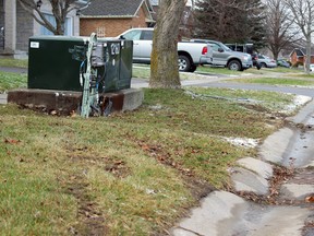 Emergency Services responded to a single-vehicle collision on Kingsdale Avenue in Kingston, Ont. on Friday December 18, 2015. The collision with an electrical box caused three fires at homes on the street. Steph Crosier/Kingston Whig-Standard/Postmedia Network
