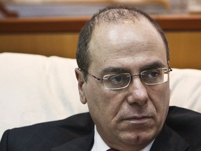 Then Israeli Energy Minister Silvan Shalom listens during an interview with Reuters at his office in Tel Aviv May 21, 2013. Shalom, a veteran politician in Prime Minister Benjamin Netanyahu's right-wing Likud party, resigned on December 20, 2015 following allegations that he had sexually harrassed several women during his career, state media reported. (REUTERS/Nir Elias)