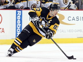 Pittsburgh Penguins center Sidney Crosby (87) skates with the puck against the Boston Bruins during the first period at the CONSOL Energy Center. Charles LeClaire-USA TODAY Sports