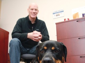 Rob McGowan with one of his client's dogs, Bear, who came into his care after the client was incarcerated.
MATT DAY/OTTAWA SUN