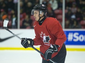 Team Canada's Jayce Hawryluk (left) pauses during second period action of a warm up game against the CIS all-stars in Toronto on Sunday, December 13, 2015, ahead of the IIHF World Junior Championships. THE CANADIAN PRESS/Chris Young