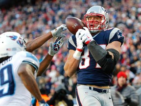 New England Patriots tight end Rob Gronkowski (87) can't control this pass in the end zone behind Tennessee Titans free safety Daimion Stafford (39) during the second half of the New England Patriots 33-16 win over the Tennessee Titans at Gillette Stadium. Winslow Townson-USA TODAY Sports