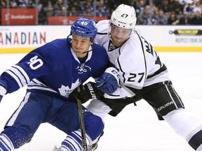 Toronto Maple Leafs right wing Michael Grabner (40) goes after the puck against Los Angeles Kings defenseman Alec Martinez (27) at Air Canada Centre. Tom Szczerbowski-USA TODAY Sports