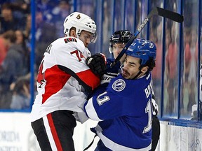Senators defenceman Mark Borowiecki (74) gets a penalty for misconduct for roughing Tampa Bay Lightning center Brian Boyle (11) during the first period of an NHL hockey game Sunday, Dec. 20, 2015, in Tampa, Fla. 
(AP Photo/Brian Blanco)
