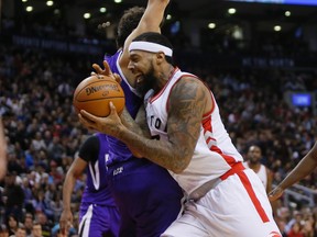 Toronto Raptors forward James Johnson (3) gets by Sacramento Kings guard Marco Belinelli (3) at the Air Canada Centre. Sacramento defeated Toronto 104-94.  John E. Sokolowski-USA TODAY Sports