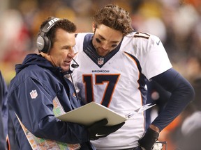 Denver Broncos head coach Gary Kubiak (L) talks with quarterback Brock Osweiler (17) on the sidelines against the Pittsburgh Steelers during the fourth quarter at Heinz Field. The Steelers won 34-27. Charles LeClaire-USA TODAY Sports