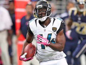Jacksonville Jaguars wide receiver Justin Blackmon carries the ball for a touchdown against the St. Louis Rams in St Louis, in this file photo taken October 6, 2013. (Scott Kane/USA TODAY Sports)