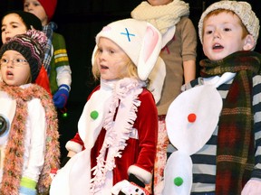 Dressed as snowmen, Upper Thames Elementary School (UTES) kindergarteners Elyn Hannon (left), Alise Crawford and Jackson Anderson sing in the school's Kindergarten Christmas Concert held last Tuesday, Dec. 15. GALEN SIMMONS/MITCHELL ADVOCATE