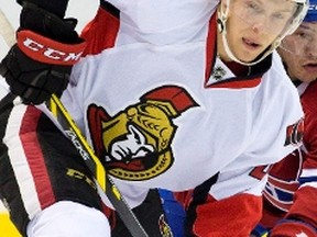 Ottawa Senators forward Ryan Dzingel wins a face-off against Montreal Canadiens forward Charles Hudon during their NHL Rookie Tournament hockey game at Budweiser Gardens in London, Ont. on Sunday September 13, 2015. Craig Glover/The London Free Press/Postmedia Network