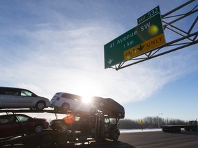 The new 41st Avenue interchange's sign is seen along the Queen Elizabeth II highway in Edmonton, Alta., on Monday December 21, 2015. The intersection was opened on Nov. 19, 2015. The project's cost came to $205-million of which the Government of Canada contributed up to $75 million, Province of Alberta invested $57.5 million and the City of Edmonton provided $72.5 million. Ian Kucerak/Edmonton Sun/Postmedia Network