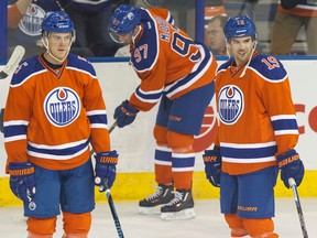 Mark Fayne, left, and Justin Schultz have both struggled at times this season on the Oilers blue-line. (Ian Kucerak, Edmonton Sun file)