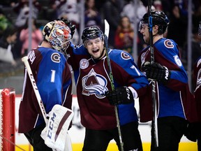 Colorado Avalanche goalie Semyon Varlamov and center John Mitchell celebrate a win over the Edmonton Oilers. (Ron Chenoy/USA TODAY Sports)