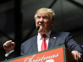 U.S. Republican presidential candidate, businessman Donald Trump addresses supporters at a campaign rally, Monday, Dec. 21, 2015, in Grand Rapids, Mich. (AP Photo/Carlos Osorio)