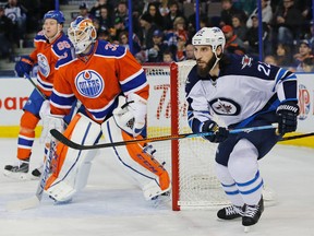Dec 21, 2015; Edmonton, Alberta, CAN;  Winnipeg Jets forward Chris Thorburn (22) watches the puck in front of Edmonton Oilers goaltender Cam Talbot (33) during the first periodat Rexall Place. Mandatory Credit: Perry Nelson-USA TODAY Sports